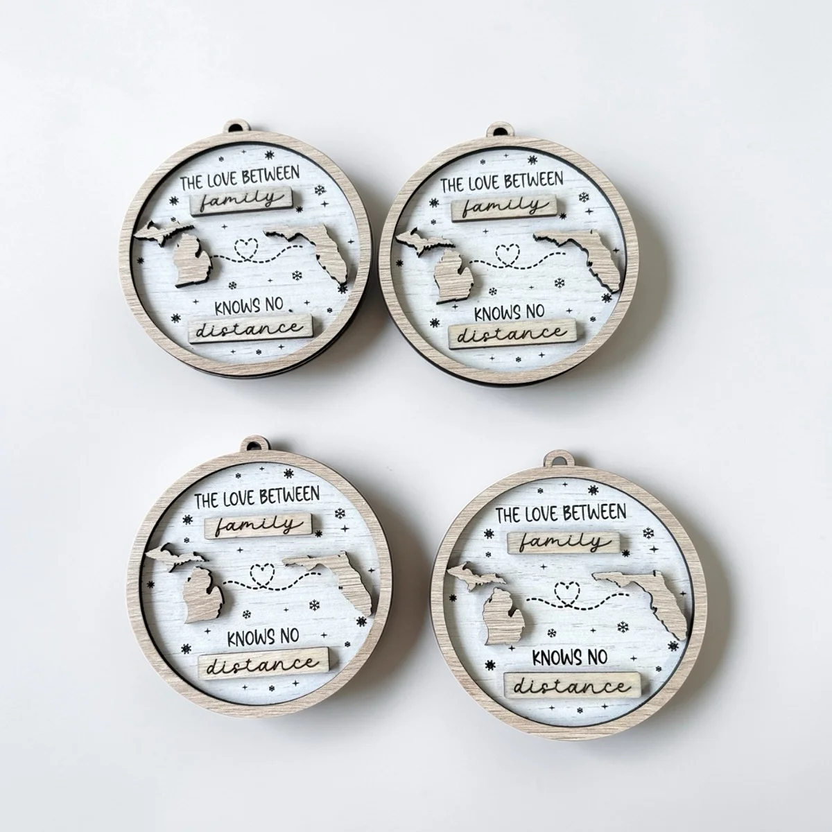 Custom state distance wood ornaments — personalized laser engraved milestone keepsakes by Palm Coast Customs